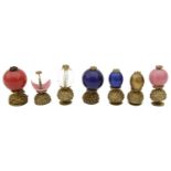 A collection of seven 19th century Qing dynasty Mandarin gilt metal and Peking glass hat buttons