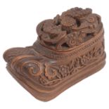 A 19th century Chinese Qing dynasty carved coquilla nut shoe shaped snuff box