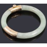 A gold jade set bangle of hinged design