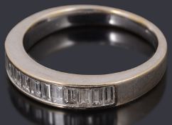 A white gold diamond half eternity ring