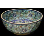 A large 19th century Iznik pottery polychrome tin glazed bowl