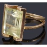 A gold single stone synthetic spinel ring