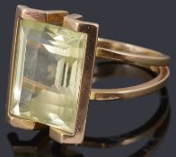 A gold single stone synthetic spinel ring