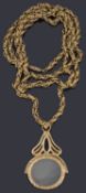 A Victorian gilt metal textured prince of Wales chain with fob