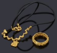 A Chinese high carat gold wedding band and necklace