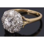 A gold and platinum diamond set cluster ring