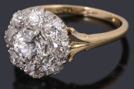 A gold and platinum diamond set cluster ring