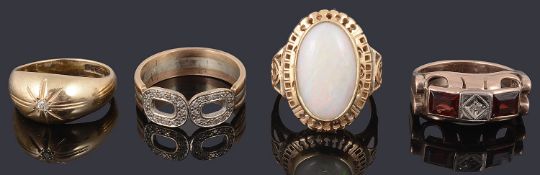 A collection of four gold rings