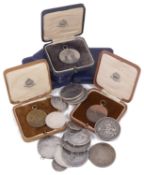 A small collection of British and foreign mostly silver coins and medallions