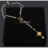 A Dolce and Gabbana simulated pearl and black paste rosary,