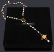 A Dolce and Gabbana simulated pearl and black paste rosary,