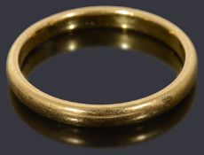 A 22ct gold court shaped wedding ring