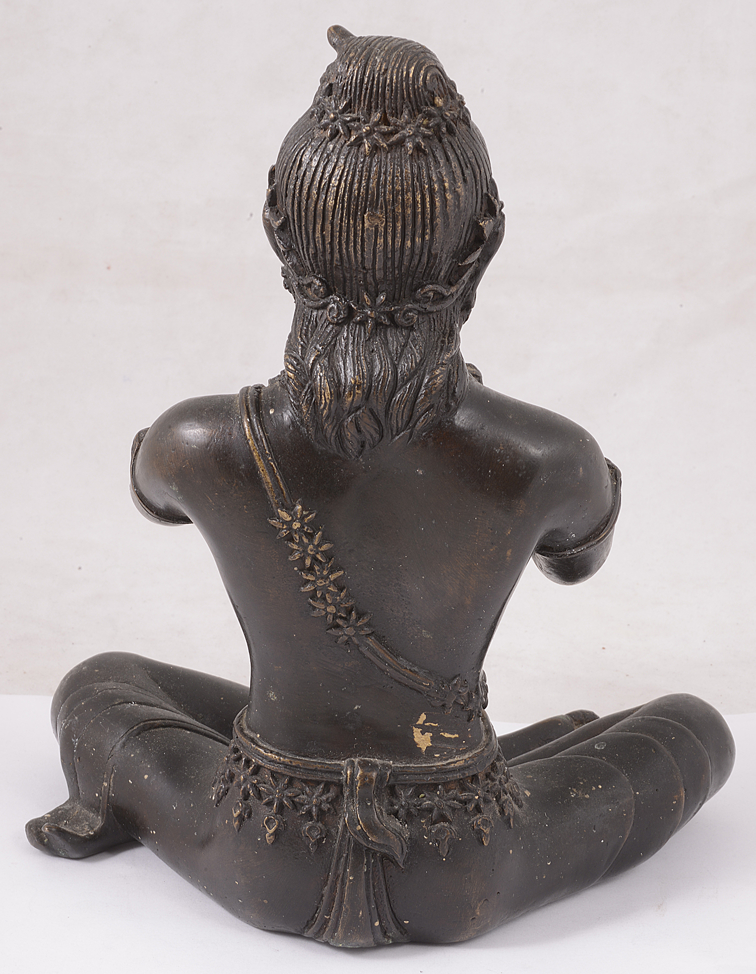 An Indian patinated bronze figure of a seated Hindu deity - Image 2 of 2