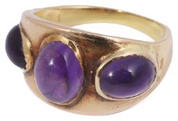 A gold three stone amethyst cabochon ring in the style of Lalaounis