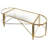 A lacquered brass and smokey glass set of three low occasional tables