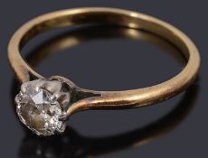 A gold single stone diamond ring,