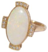 A pretty gold opal and diamond ring