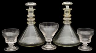 A pair of late 19th century triple ring neck ships decanters and three mid 19th century rummers