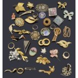 A collection of interesting brooches and rings