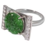 A white gold jade and diamond ring