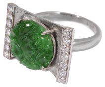 A white gold jade and diamond ring