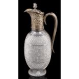 A late Victorian silver mounted cut glass claret jug