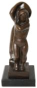 A bronze figure of a standing female nude