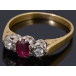 A gold ruby and diamond three stone ring