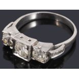 An Art Deco three stone diamond ring