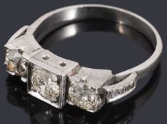 An Art Deco three stone diamond ring