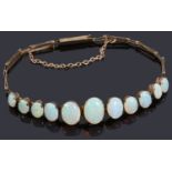 A delicate Edwardian graduated opal centrepiece bracelet