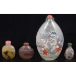 A large early 20th century Chinese inside painted glass snuff bottle and three others
