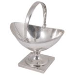 A contemporary Channel Islands silver swing handled sugar basket