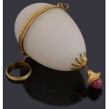 A late 19th century French gilt metal mounted frosted glass egg shaped etui for a child