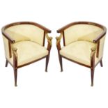A pair of late French Empire style mahogany framed tub armchairs with ormolu mounts c.1900