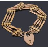 A Victorian gold four row fancy link bracelet with padlock