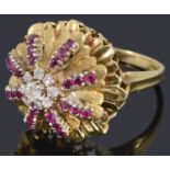 An 18ct gold diamond and ruby bombe shaped cocktail ring