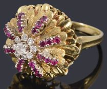 An 18ct gold diamond and ruby bombe shaped cocktail ring