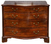 A George III mahogany and satinwood crossbanded serpentine chest of drawers