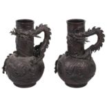 A pair of Japanese Meiji period bronze dragon vases