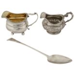 Late George III cream jug, a William IV cream jug and a George III Old English pattern basting spoon