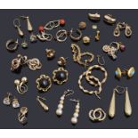 A large collection of gold earrings