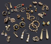 A large collection of gold earrings