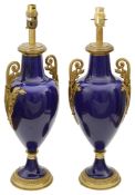 A pair of late 19th/early 20th century French ormolu mounted Sevres style cobalt blue vases