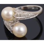 A cultured pearl and diamond crossover ring