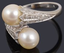 A cultured pearl and diamond crossover ring