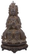 A late Ming Chinese gilt-bronze figure of Songzi Niangniang on a carved hardwood throne