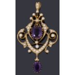 An Edwardian gold amethyst and seed pearl open framed pendant
