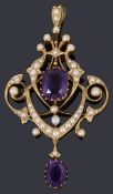 An Edwardian gold amethyst and seed pearl open framed pendant