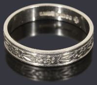 A platinum flat section wedding ring